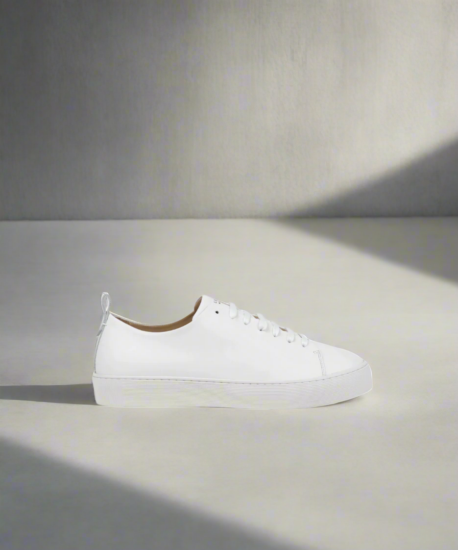 White sneaker on a gray background