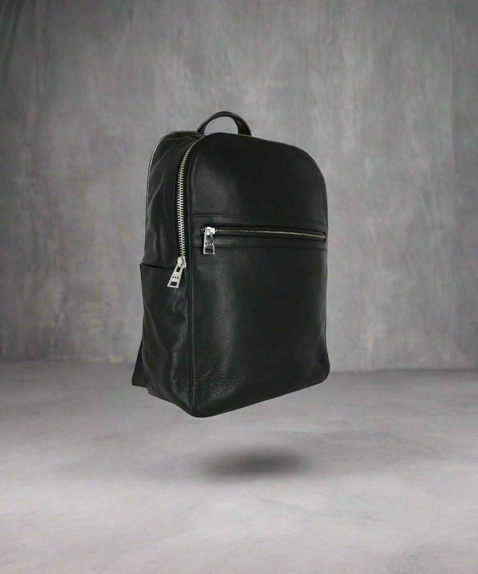 Black backpack on a gray background