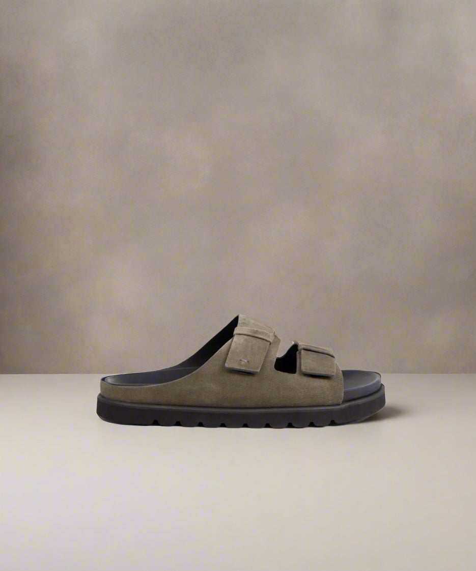 A dark khaki and anthracite men's sandal with two straps and a flat, cushioned sole.