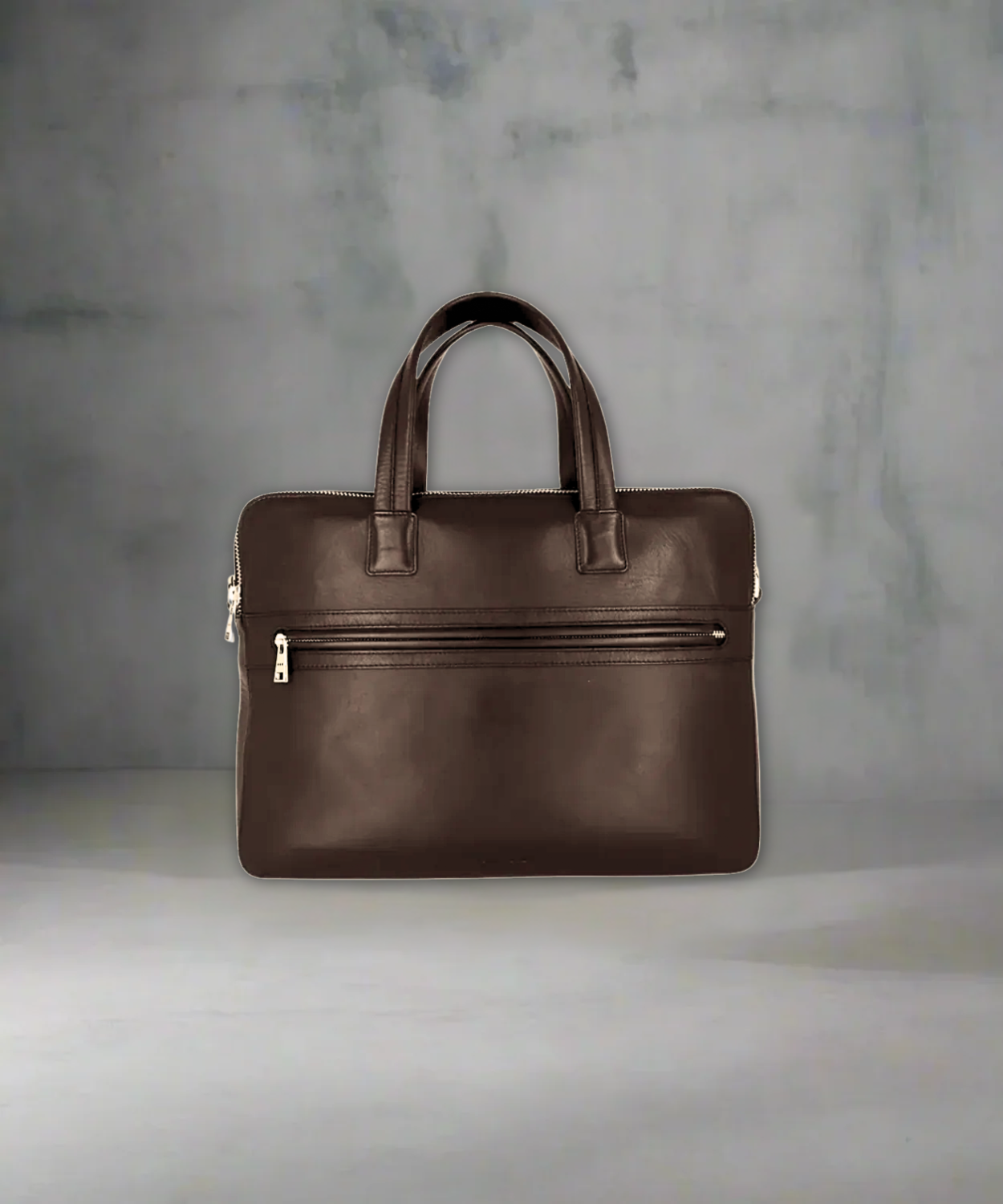 Brown Royal RepubliQ leather briefcase on a gray background
