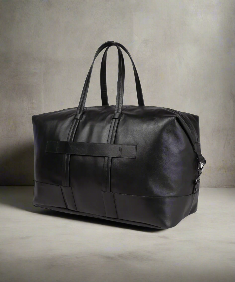 Black Royal RepubliQ leather duffel bag on a neutral background