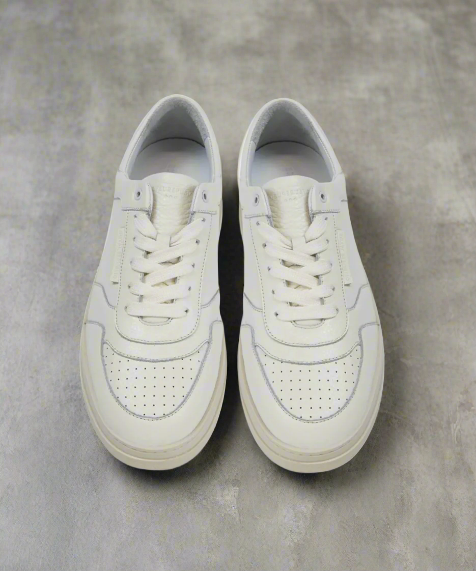 White Royal RepubliQ sneakers on a light gray background