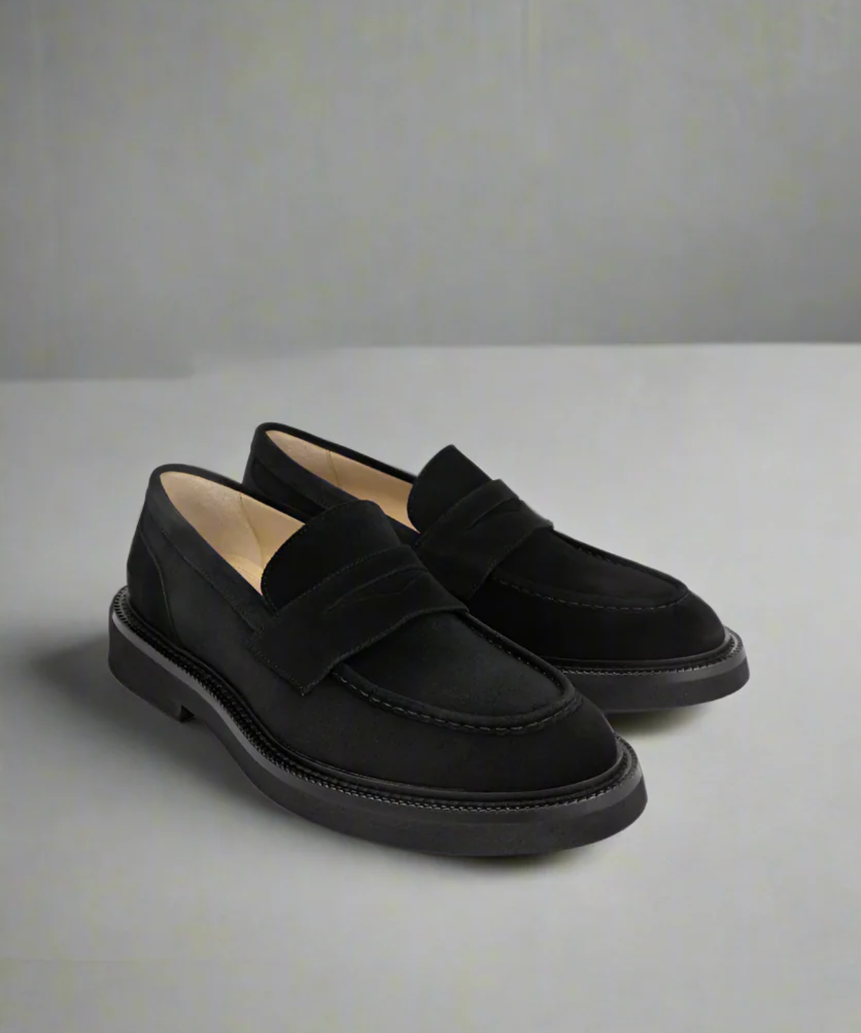 Pair of black loafers on a light gray background from Royal RepubliQ