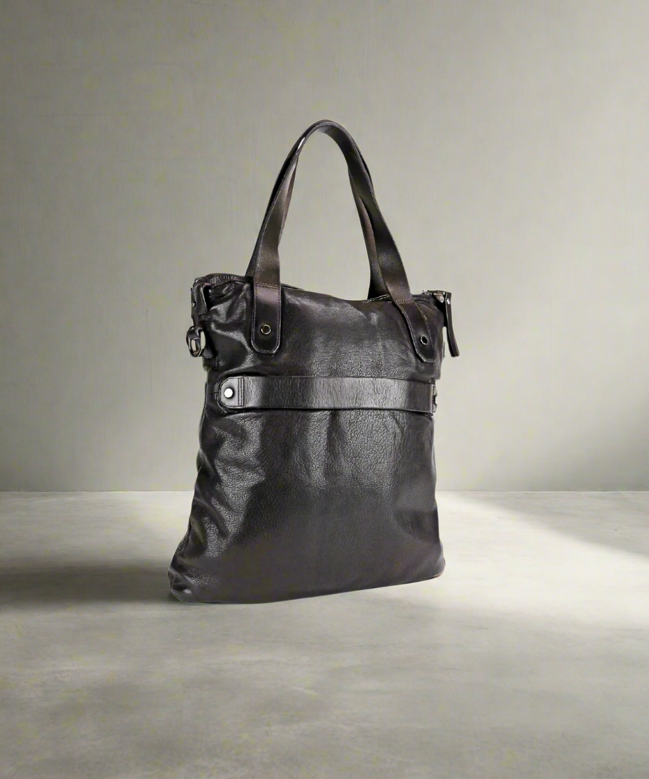 Brown leather handbag on a white background
