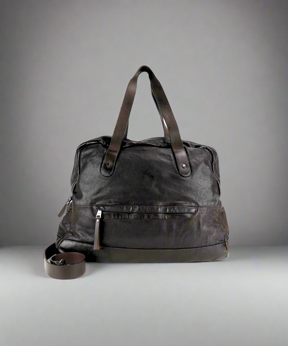 Dark Brown Royal RepubliQ washed leather duffel bag on a gray background
