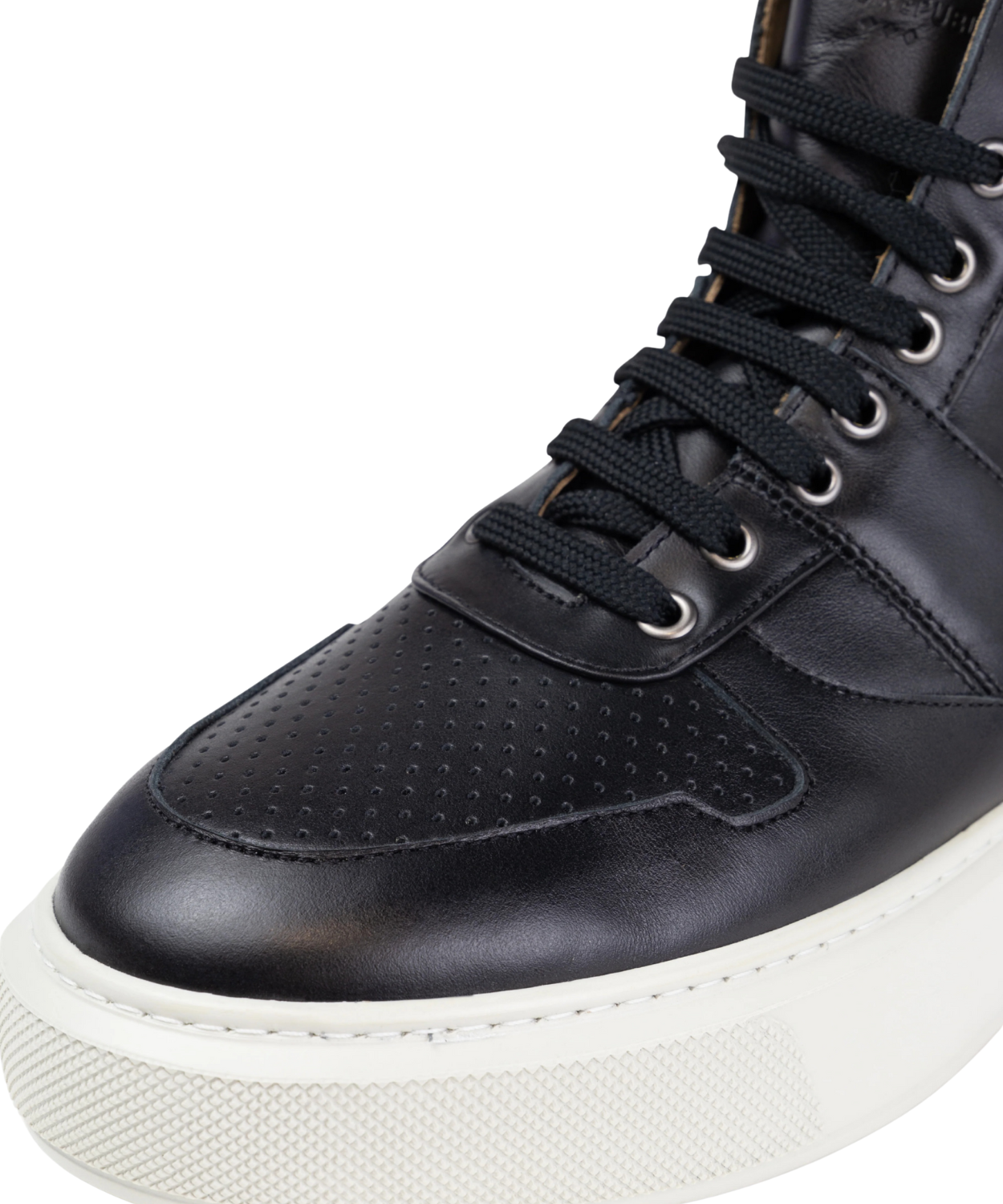 Black high-top sneaker with white sole on a gray background