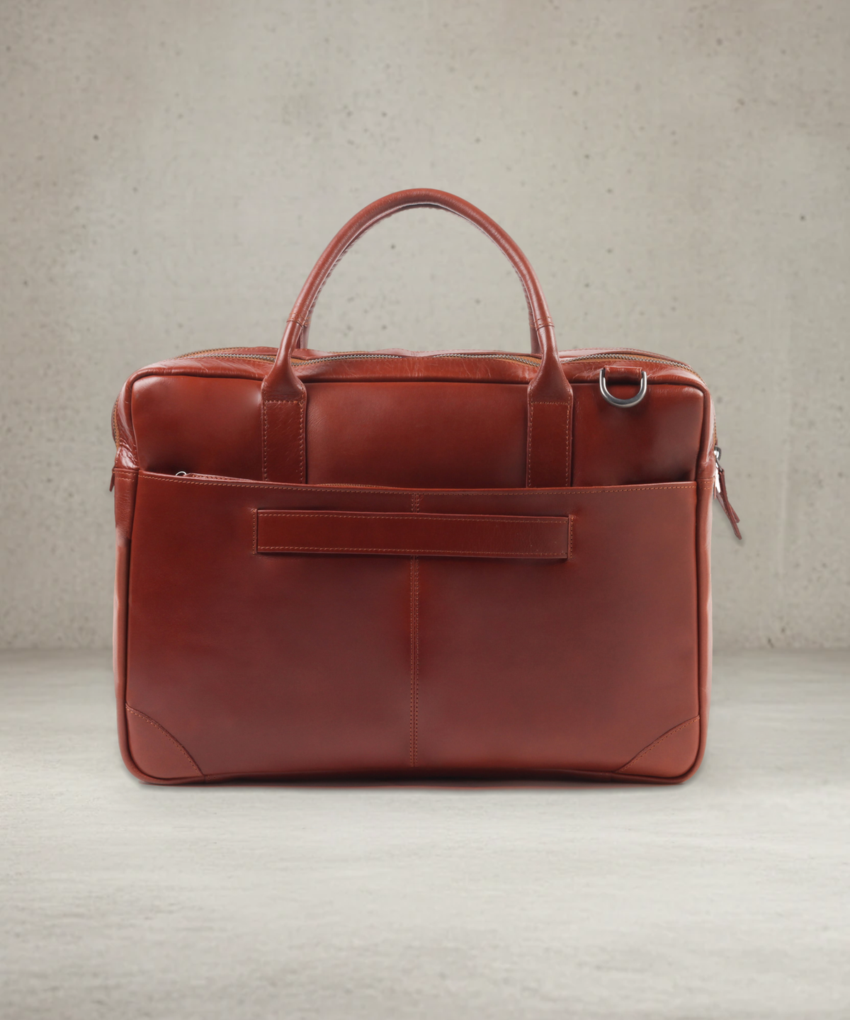 Explorer Laptop Bag Double 151 in cognac leather, back view with trolley strap