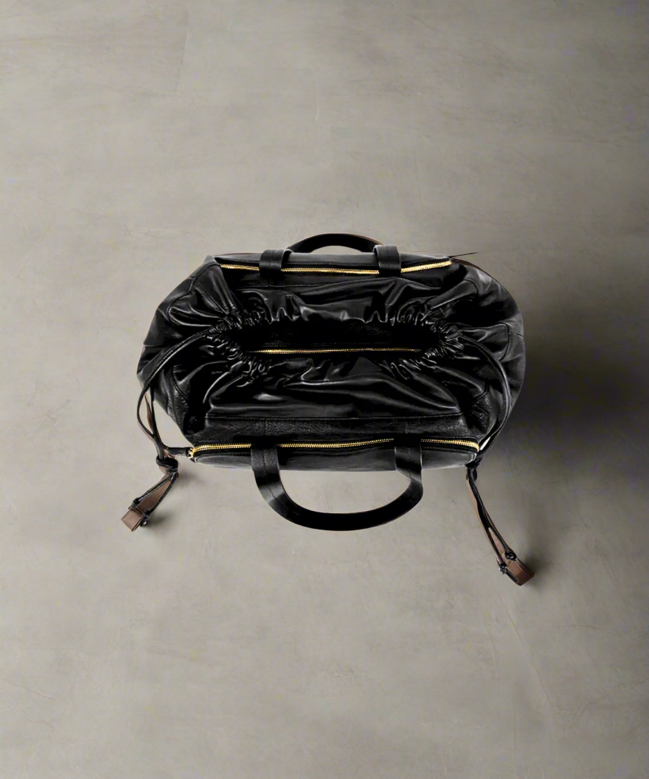 Leia Weekender Bag 241 | BlackBlack Royal RepubliQ leather duffel weekend bag for women on a gray background.