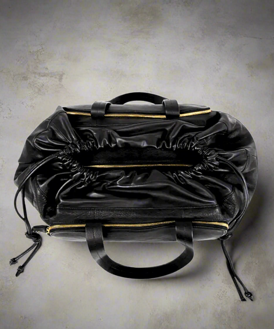 Leia Weekender Bag 241 | BlackBlack Royal RepubliQ leather duffel weekend bag for women on a gray background.
