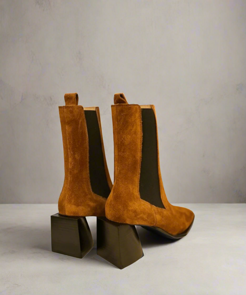 Tan Royal RepubliQ suede boot with a block heel on a light gray background