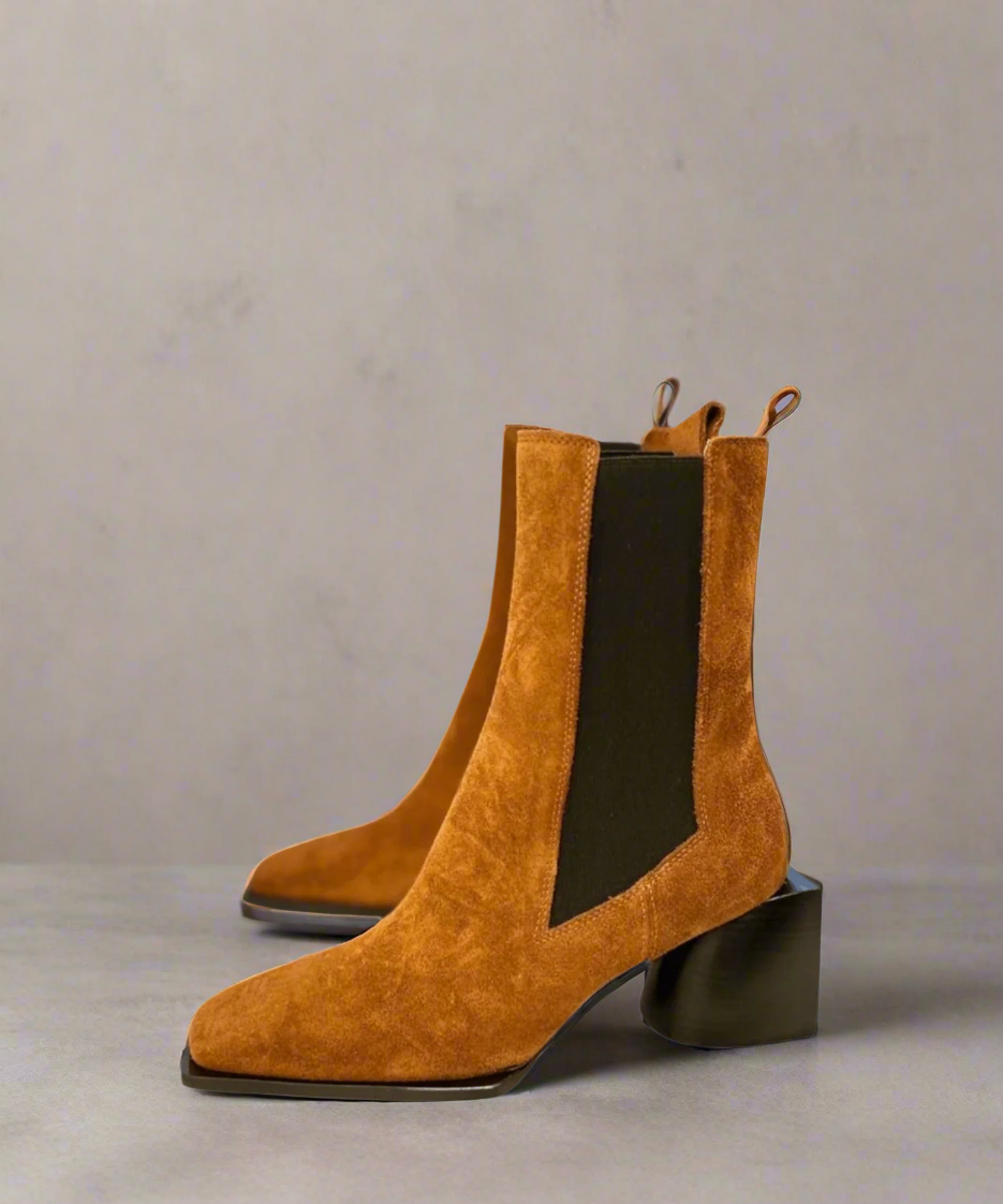Tan Royal RepubliQ suede boot with a block heel on a light gray background