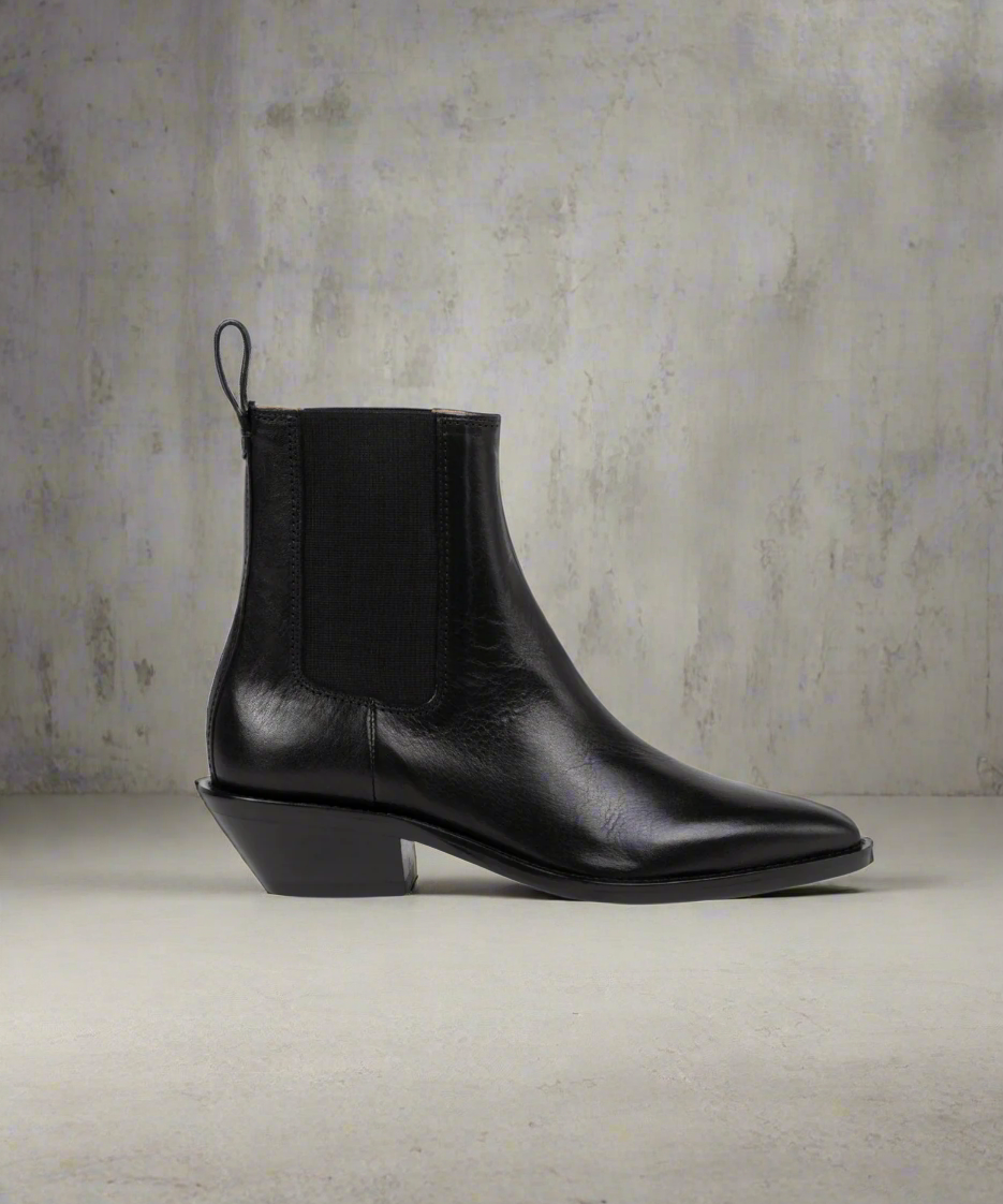 Black Royal RepubliQ leather Chelsea boot on a textured gray background