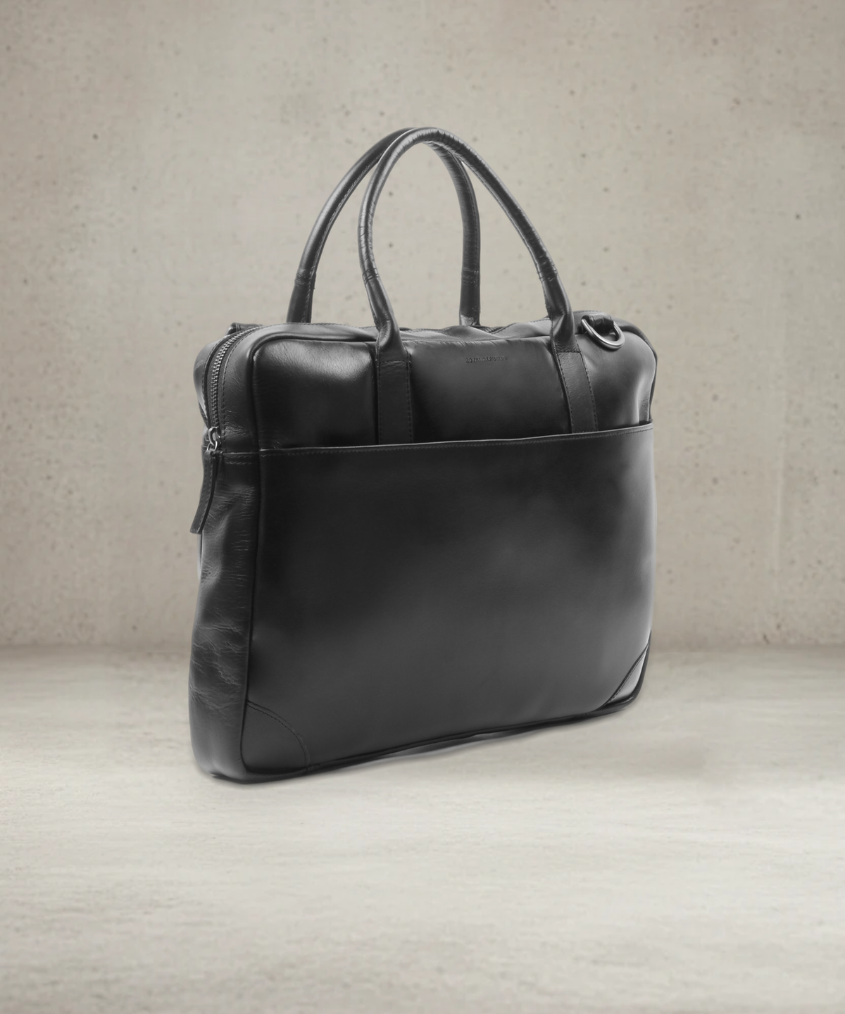 Black leather laptop bag, three-quarter view