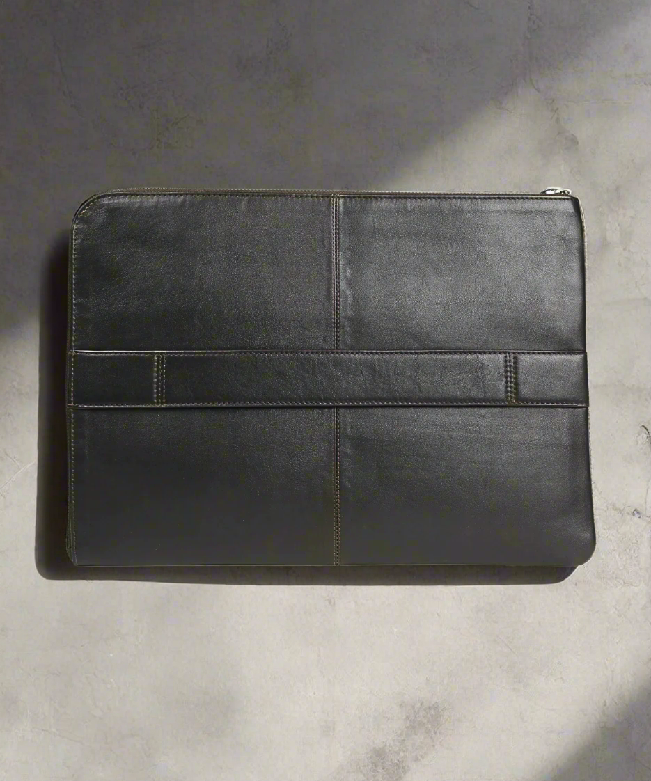 Black leather sleeve on a gray background