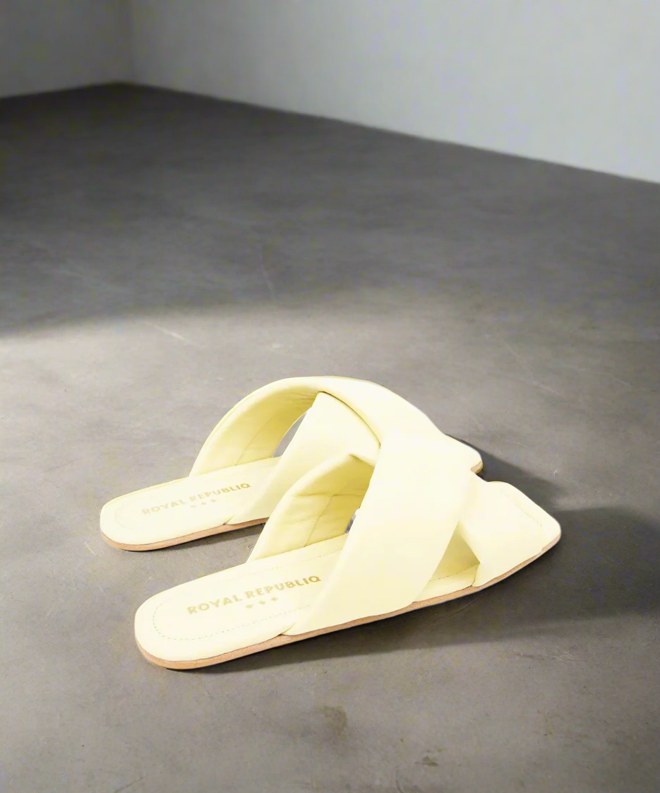 Pair of light yellow slides on a grey background