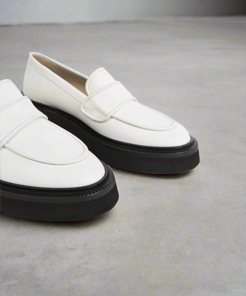White loafer on gray back-ground