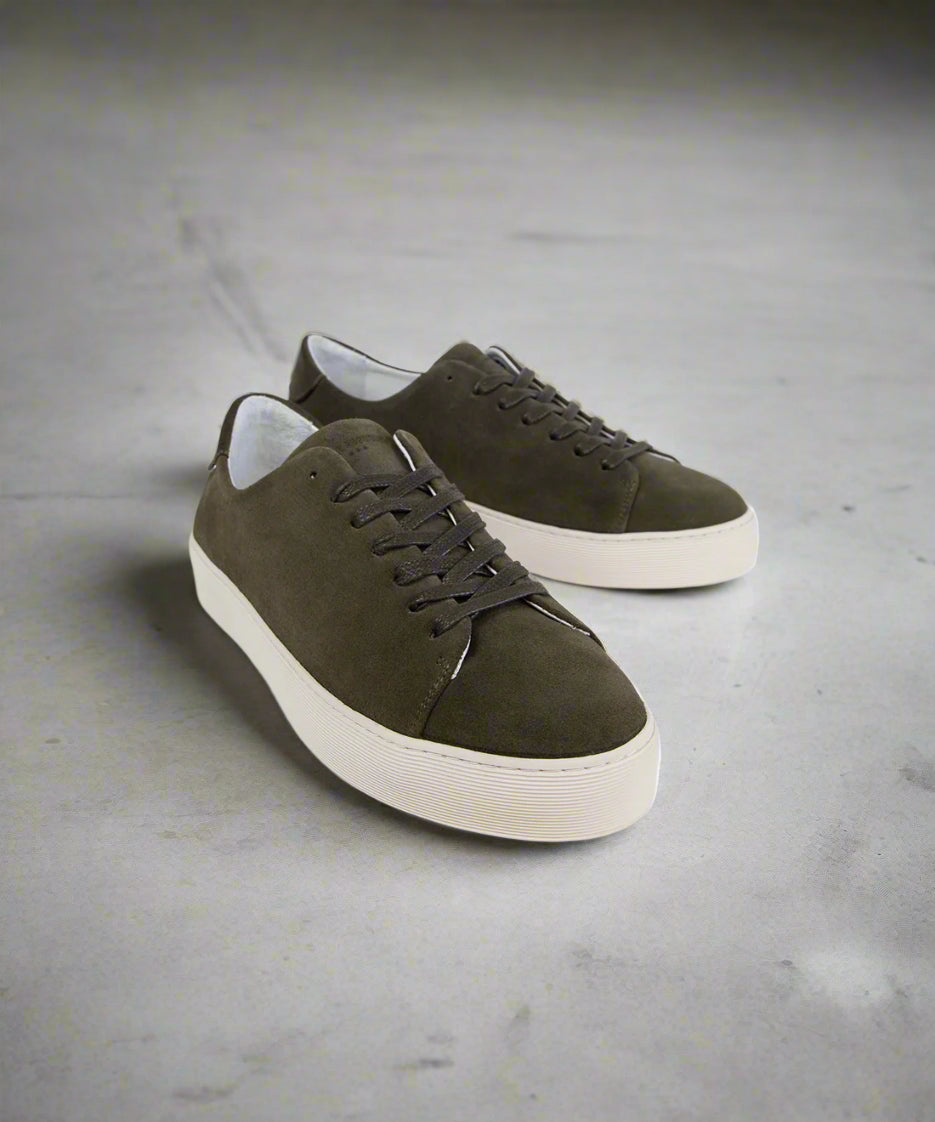 Pair of Khaki suede sneakers on a light gray background