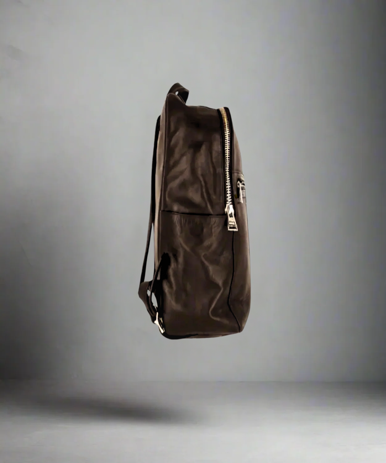 Brown Royal RepubliQ backpack on a gray background