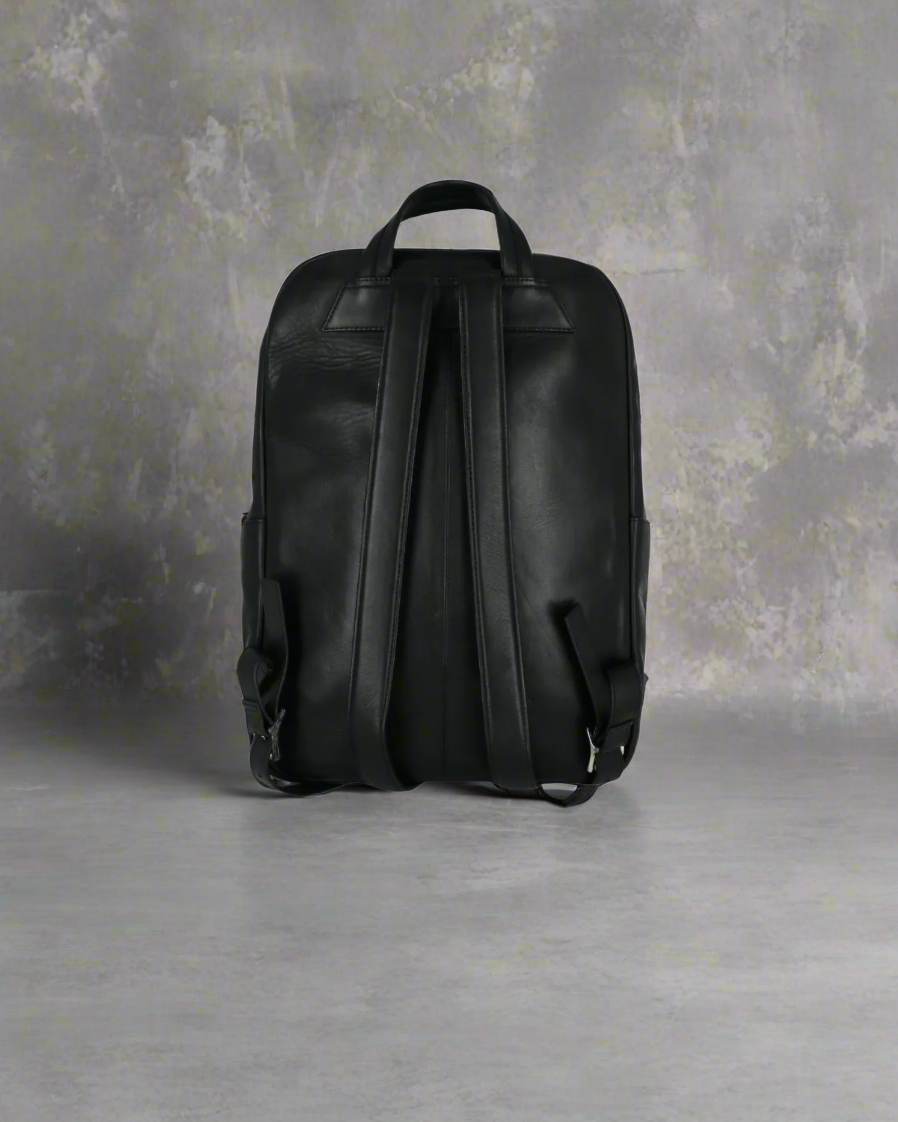 Black Royal RepubliQ leather backpack on a Gray background