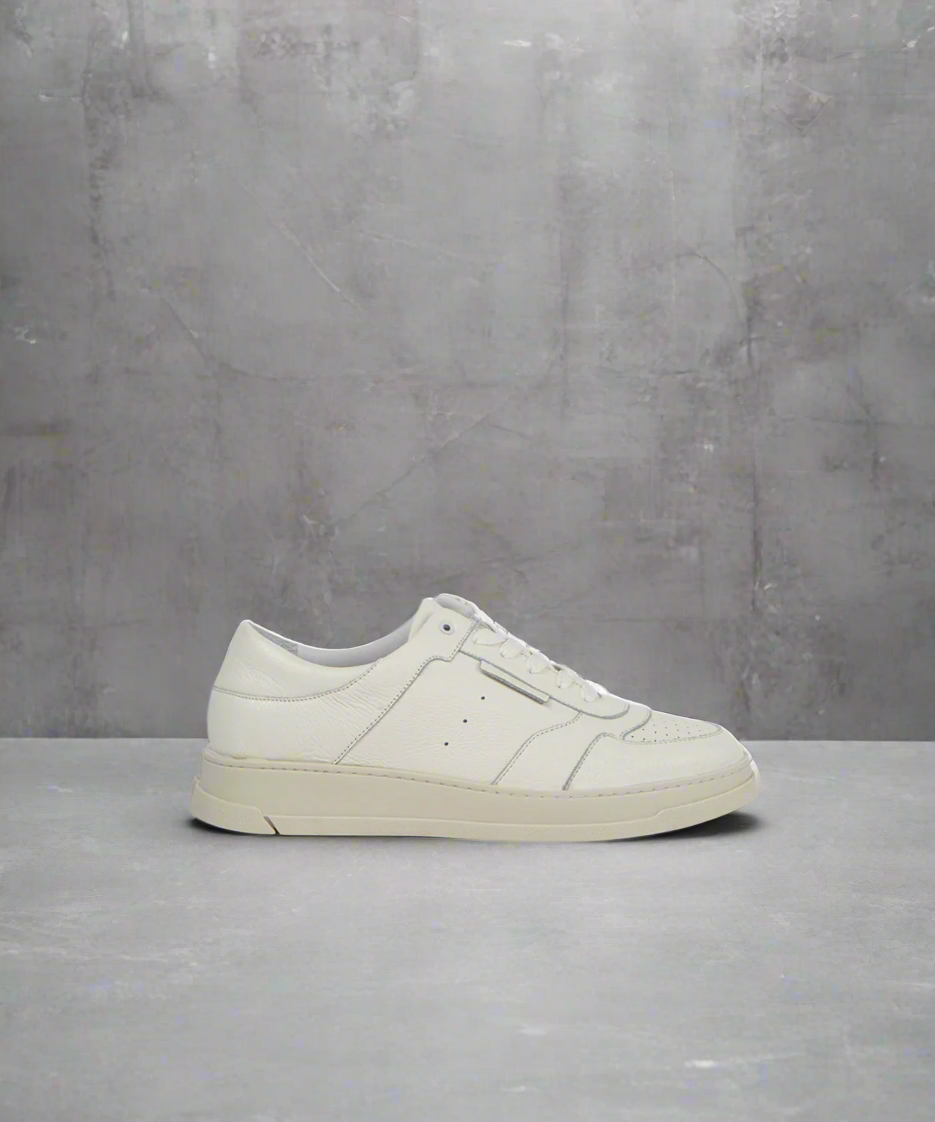 White sneaker on a gray concrete background