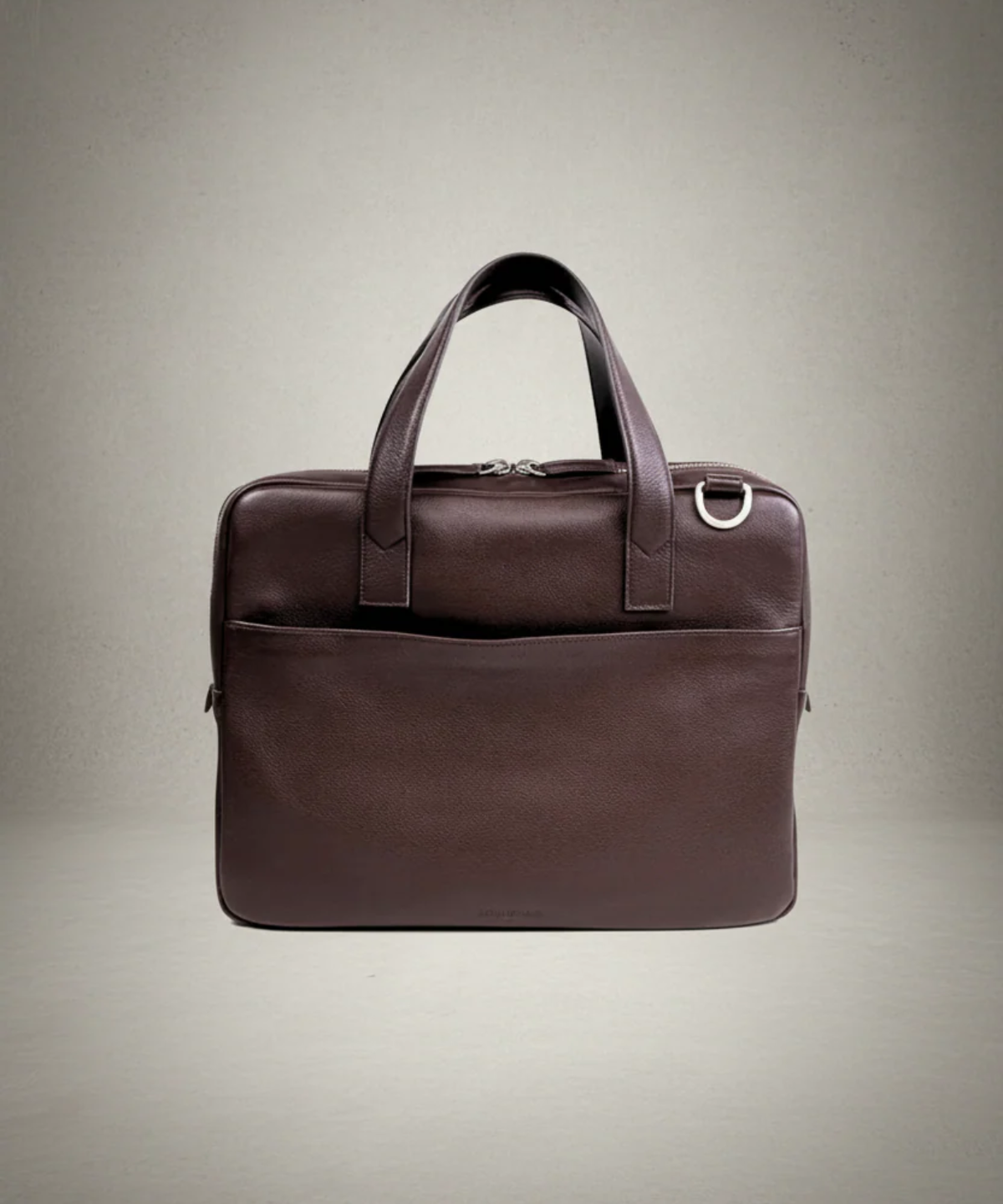 Brown leather briefcase on a beige background