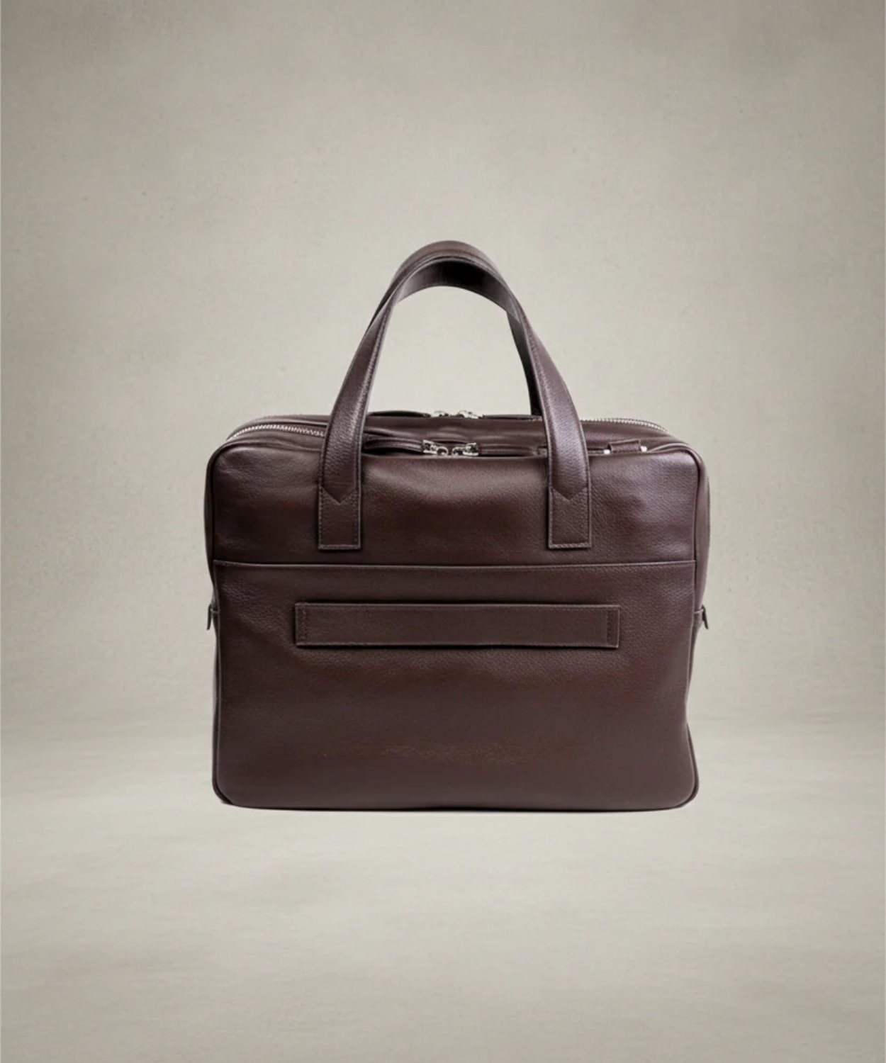 Brown leather briefcase on a beige background