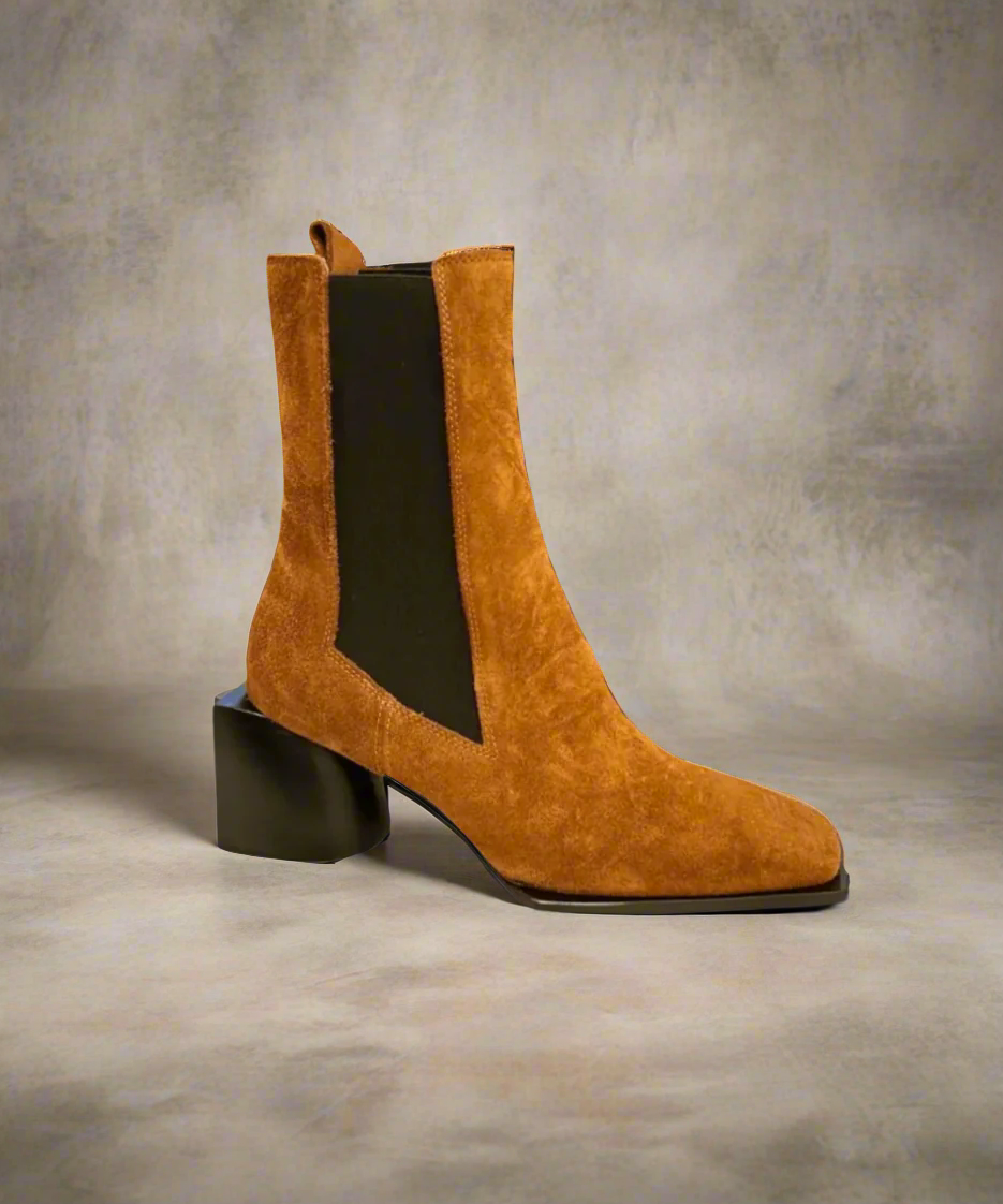 Tan Royal RepubliQ suede boot with a block heel on a light gray background