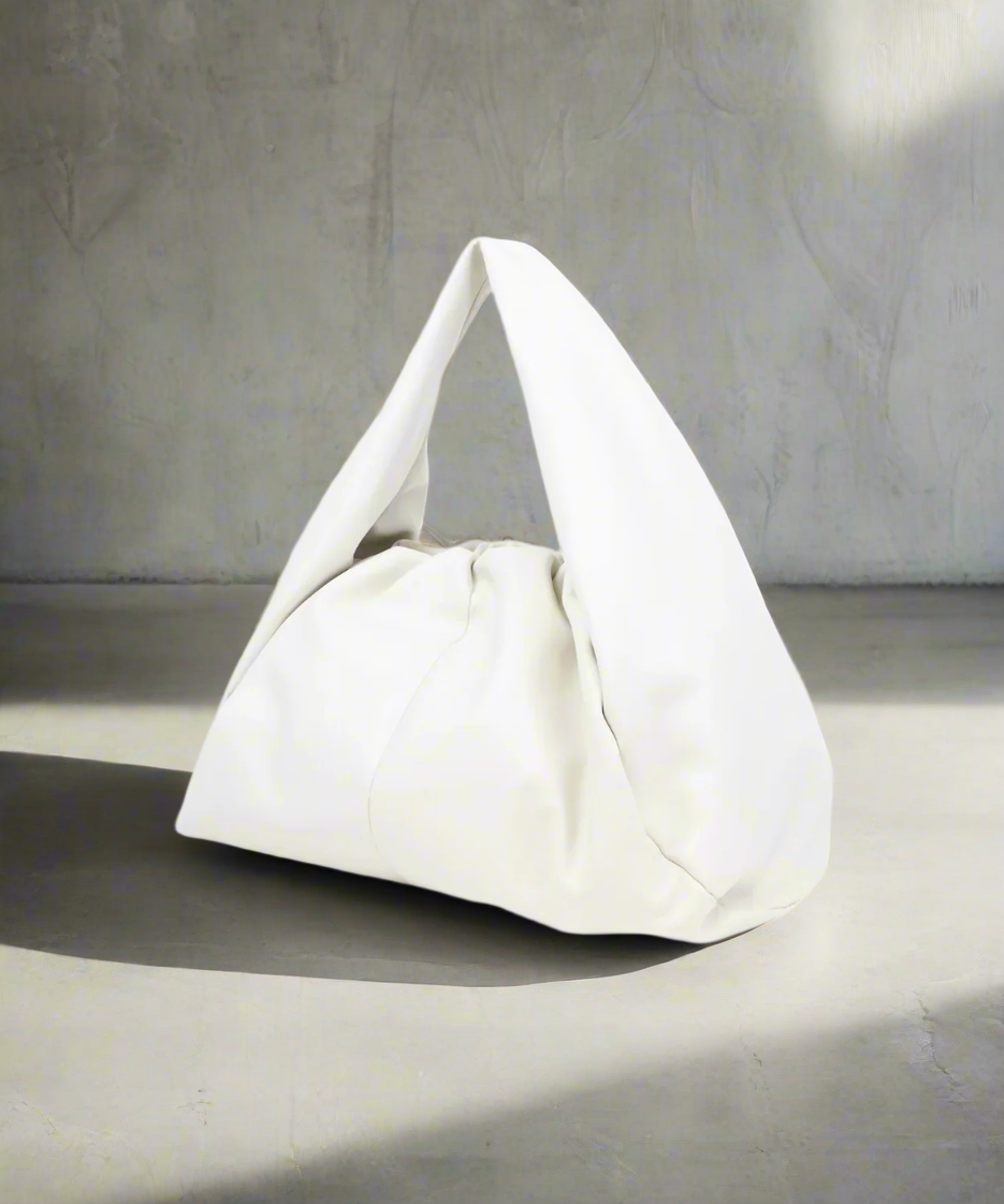 White handbag on a Gray background