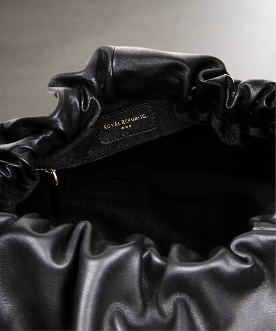 Black satin hair scrunchie with 'ROYAL REPUBLIC' label on a white background