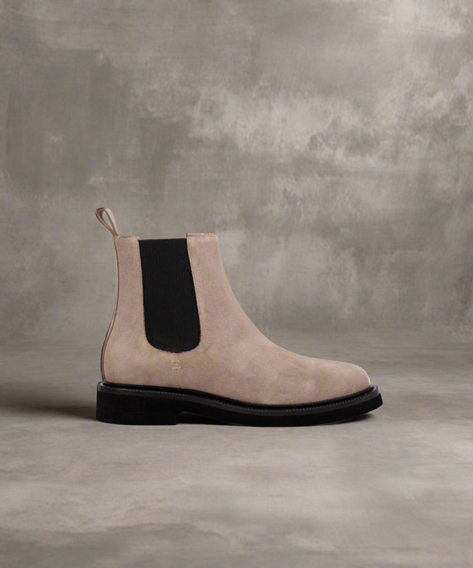 A hazel brown suede Chelsea boot with elastic side panels and a black block heel.