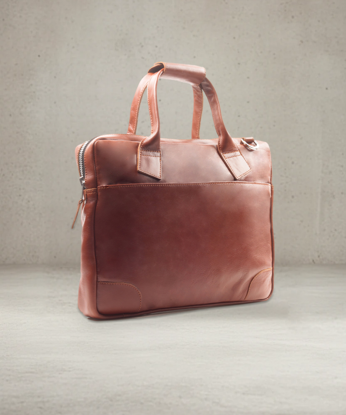 Cognac leather briefcase, three-quarter view