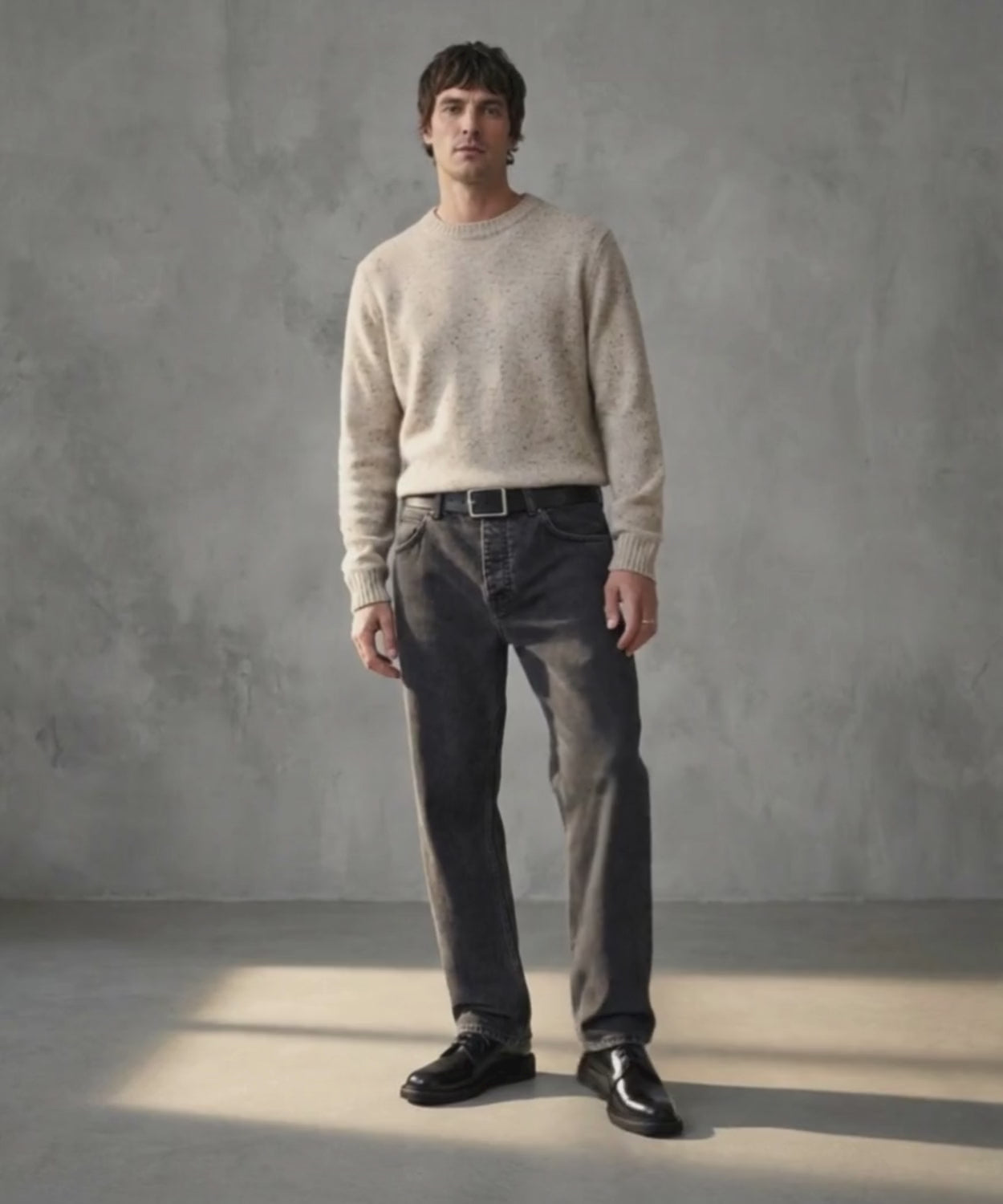 Man wearing black jeans and black Royal RepubliQ derby shoes